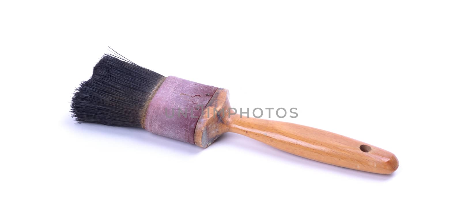 Old and used paint brush, on white background