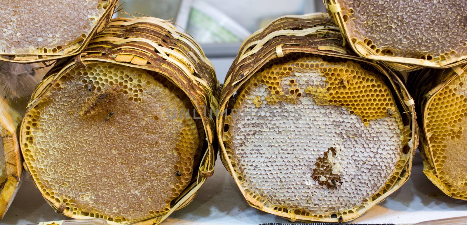 Fresh honey in the sealed comb frame by berkay