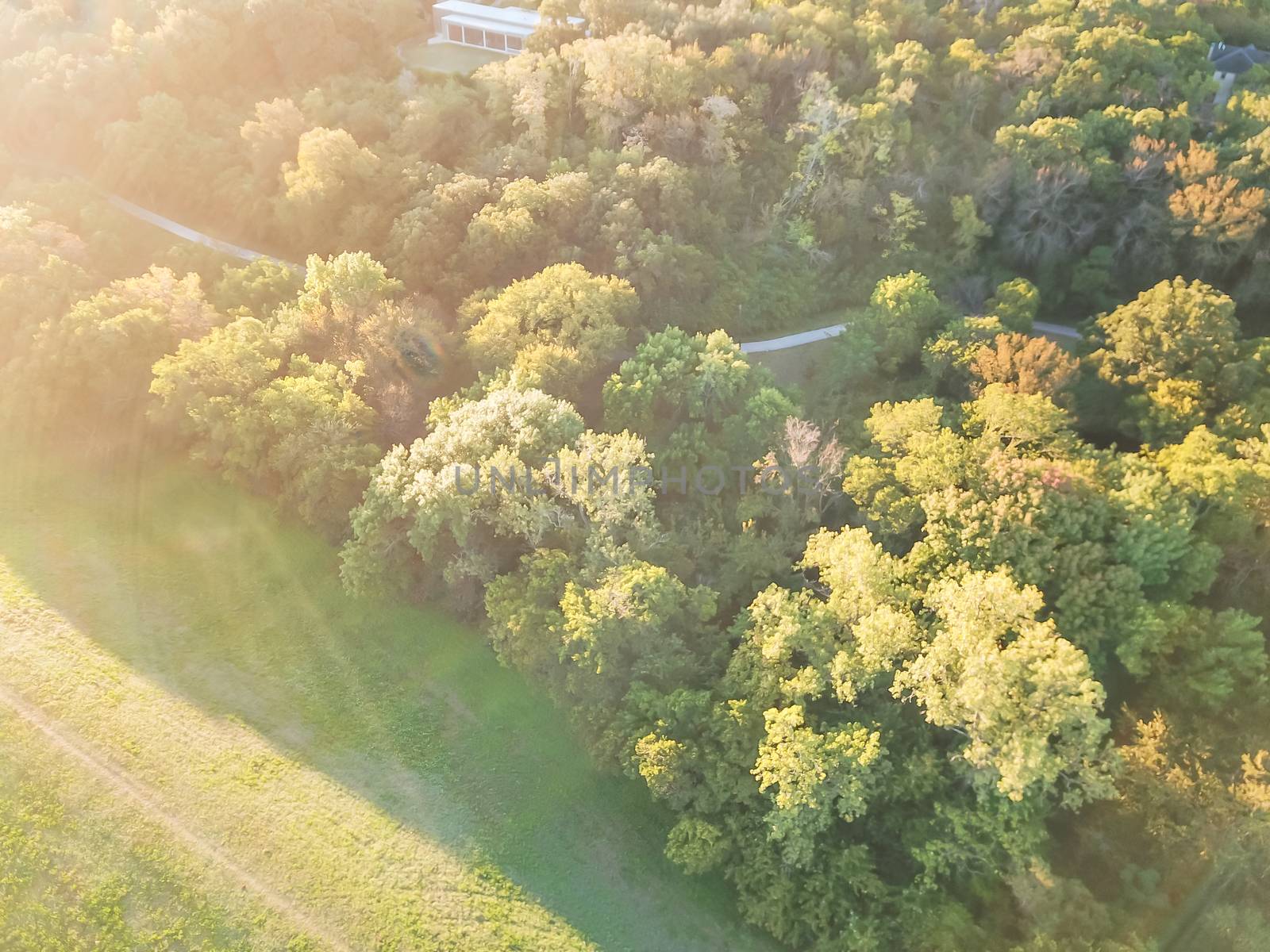 Aerial drone view Kessler Park located just south of downtown Dallas, Texas, USA. Flyover nature area with mature trees and rolling hill terrain