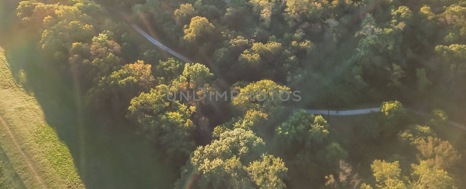 Panorama aerial drone view Kessler Park located just south of downtown Dallas, Texas, USA. Flyover nature area with mature trees and rolling hill terrain