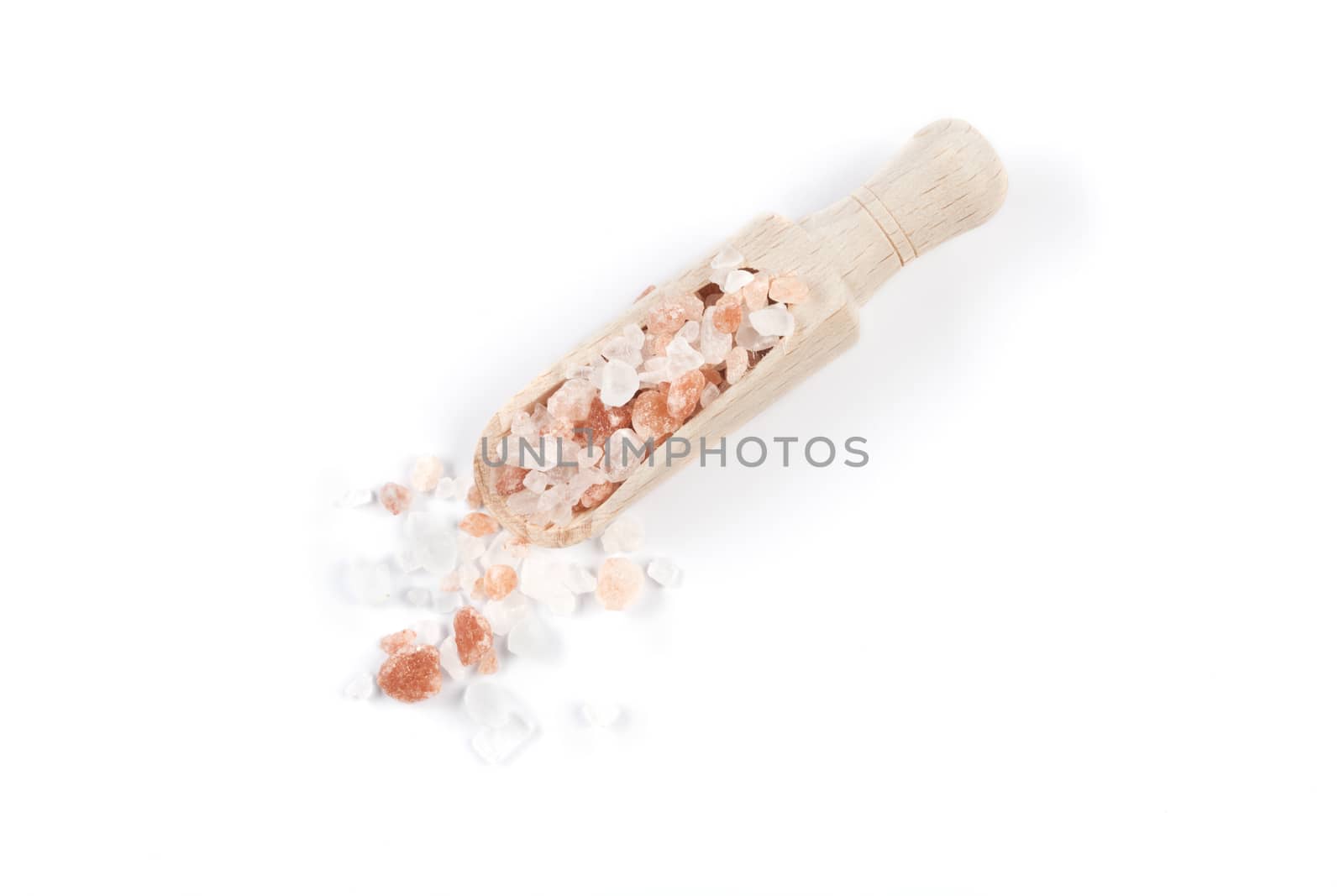 Himalayan Salt Raw Crystals Pile with Brown Wood Spice Scoop Isolated on White Background