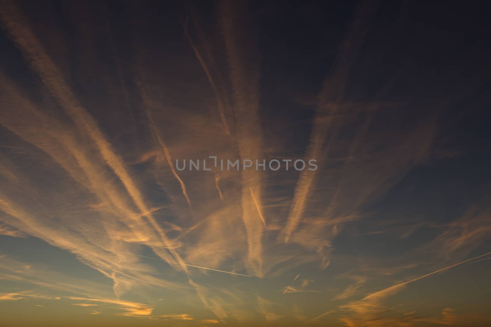 Airplane Trails on Morning Sunrise Cloudy Sky