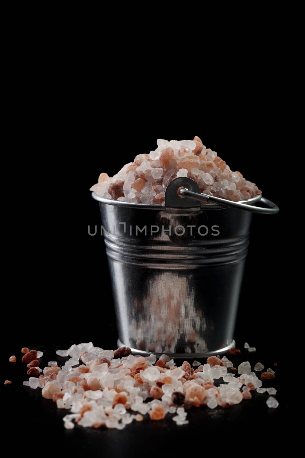 Silver Metal Bucket With Pink Himalayan Salt on Black Background