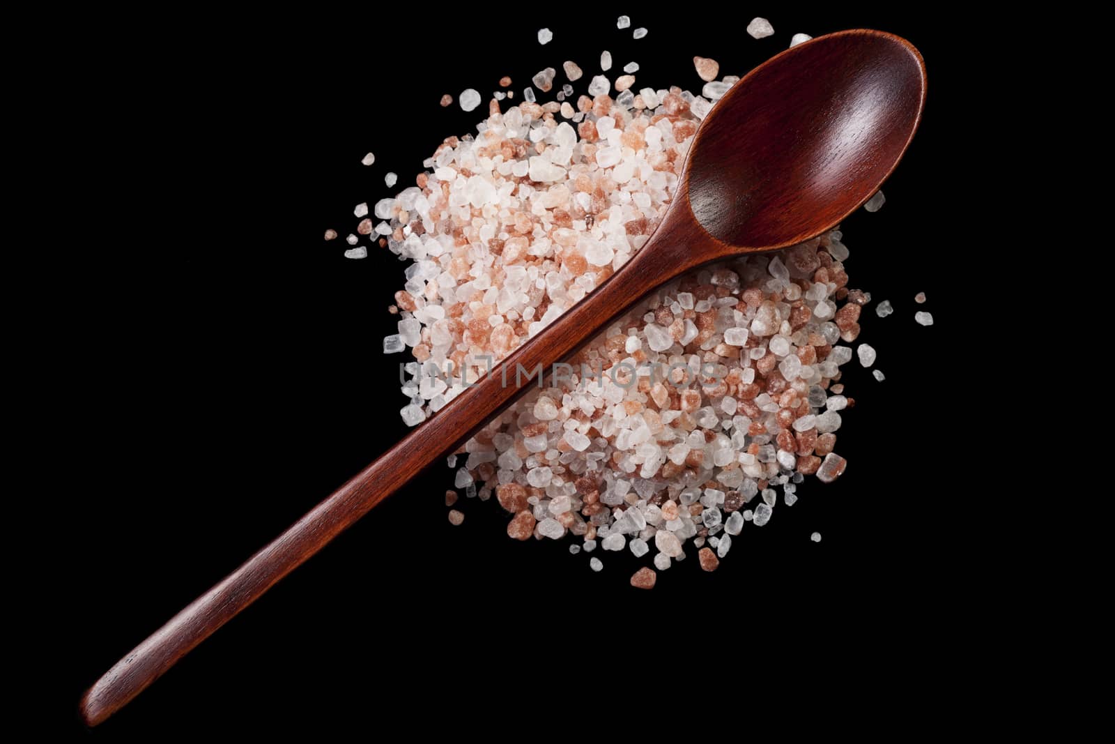 Brown Wood Spoon on Pile of Himalayan Salt Crystals