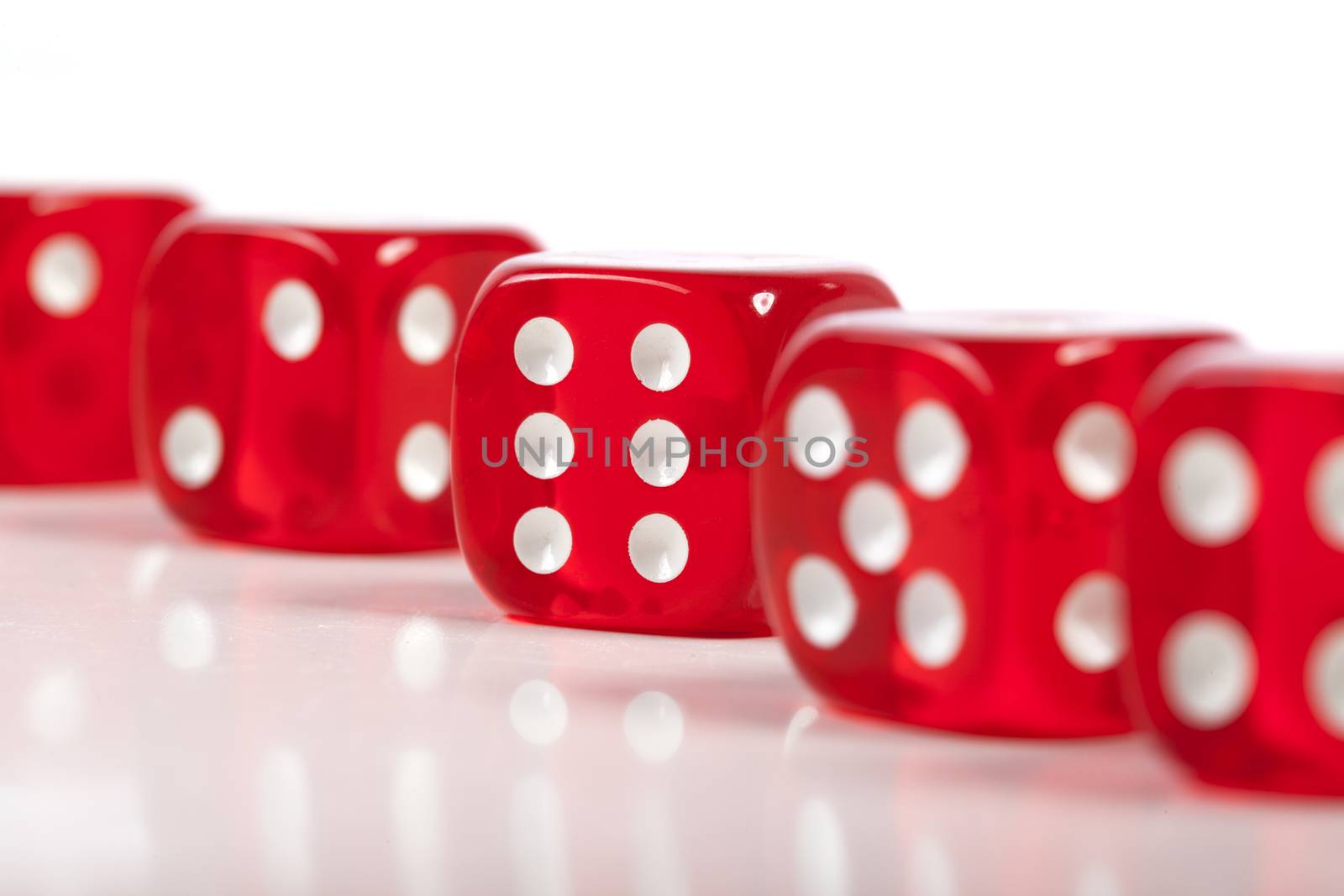 Red Casino Dice Row Closeup on Six White Seamless Background