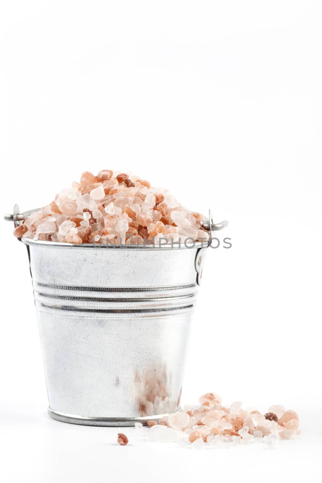 Himalayan Salt Raw Crystals Pile in Silver Metal Bucket Isolated on White Background