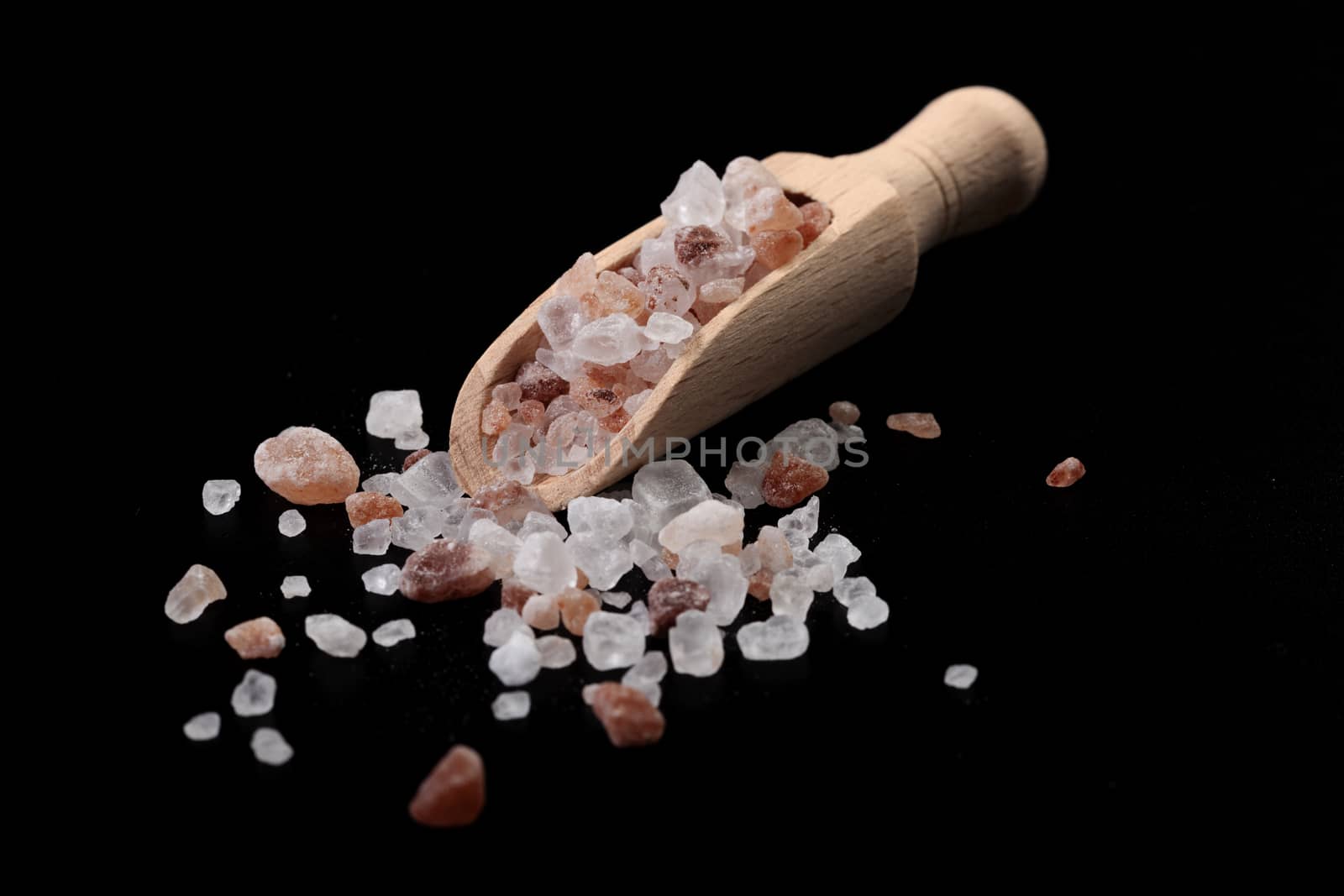 Wood Spice Spoon With Himalayan Salt on Black Background