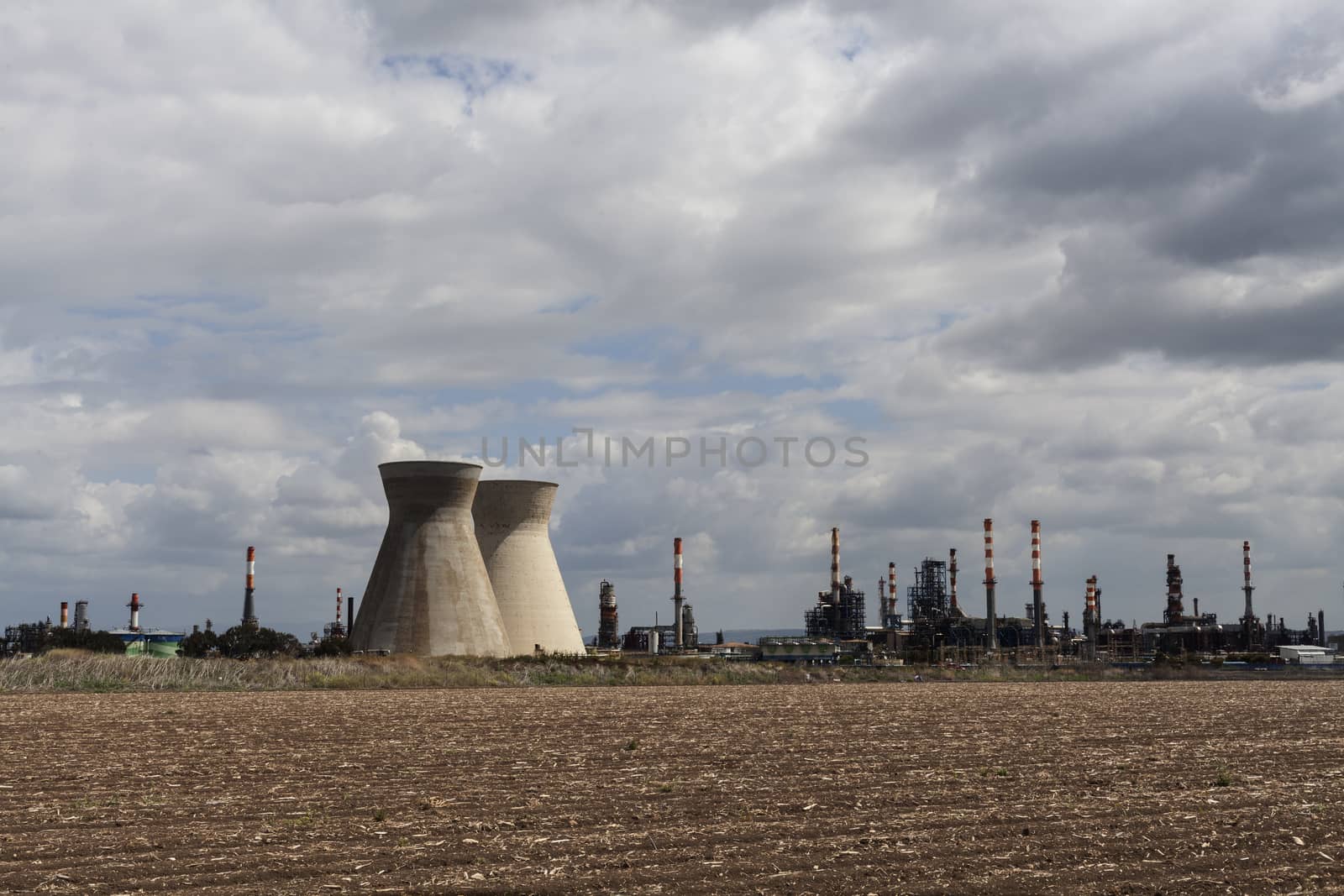 Industry and agriculture landscape with cloudy sky