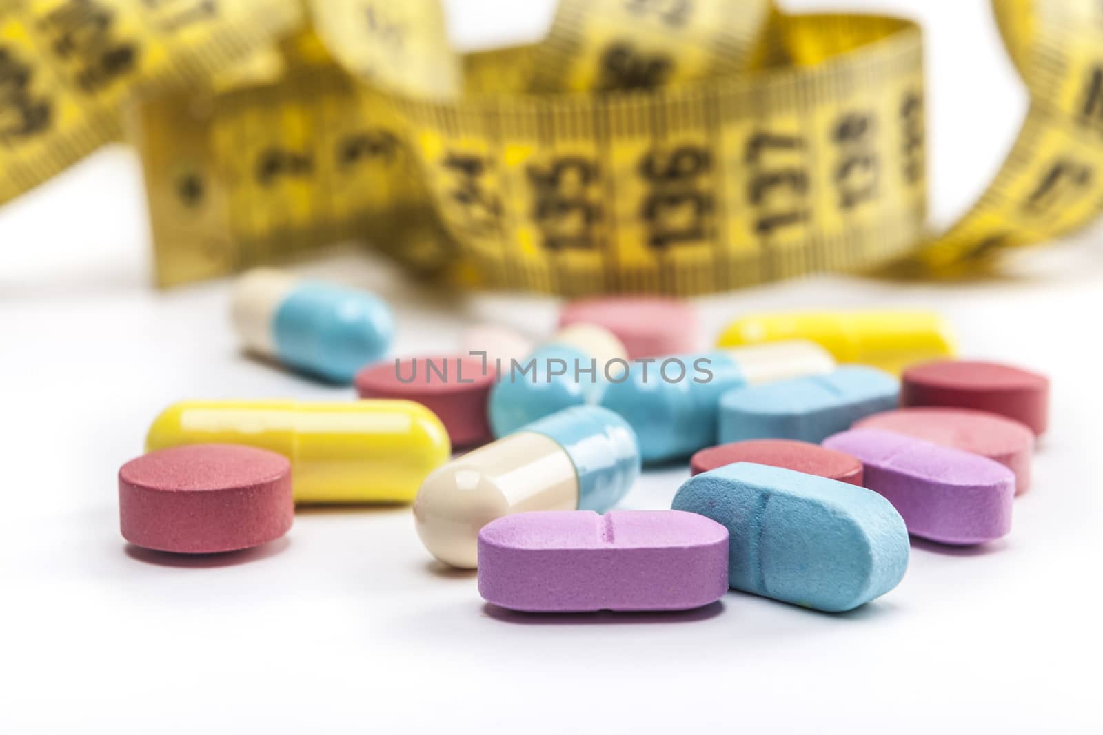 Colorful pills isolated on whiteb background with shadow