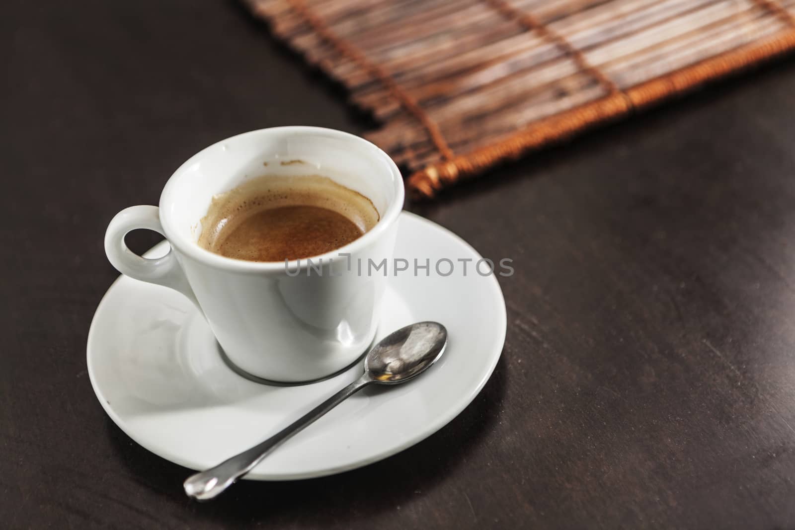 A white cup filled with delicious coffee