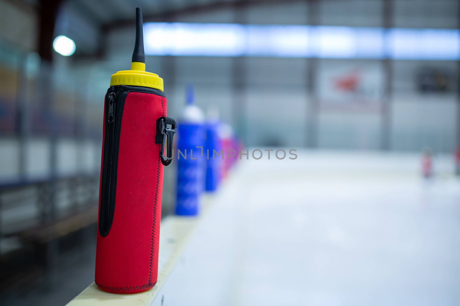 drink red bottle on board ice hockey rink