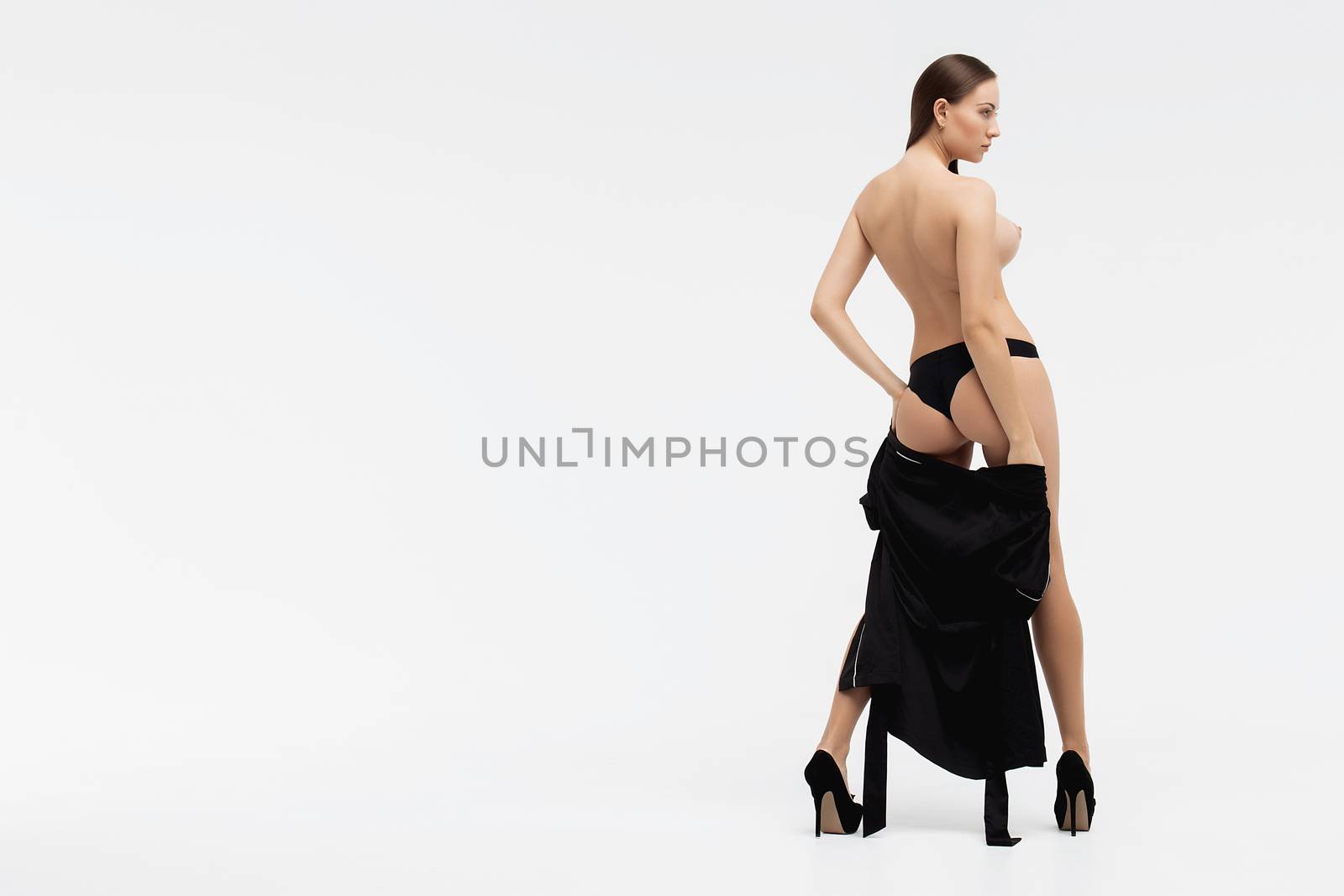 Perfect body young woman on a white background in sexy lingerie