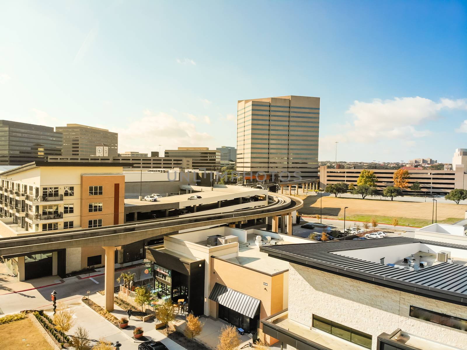 Top view light rail system and skylines in downtown Las Colinas, by trongnguyen