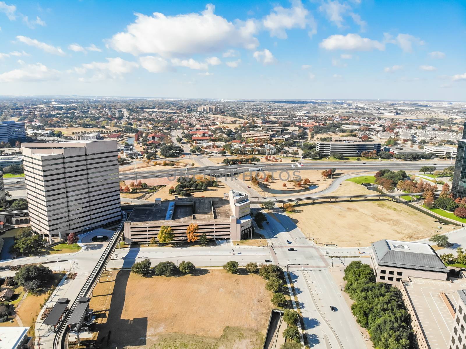 Top view light rail system and skylines in downtown Las Colinas, by trongnguyen