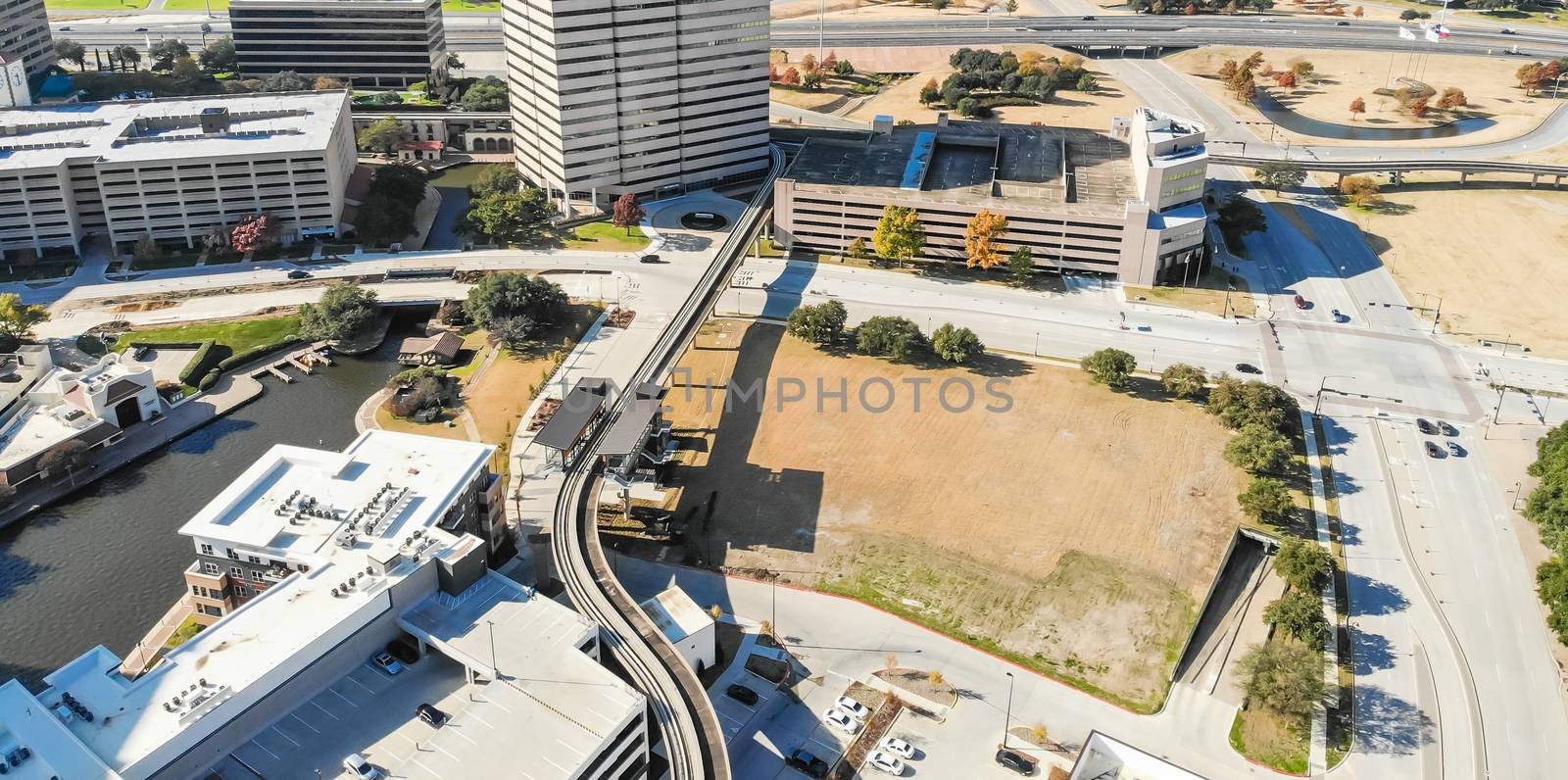 Panorama aerial view downtown Las Colinas, Irving, Texas and light rail system (Area Personal Transit, APT). Las Colinas is an upscale, developed area in the Dallas suburb