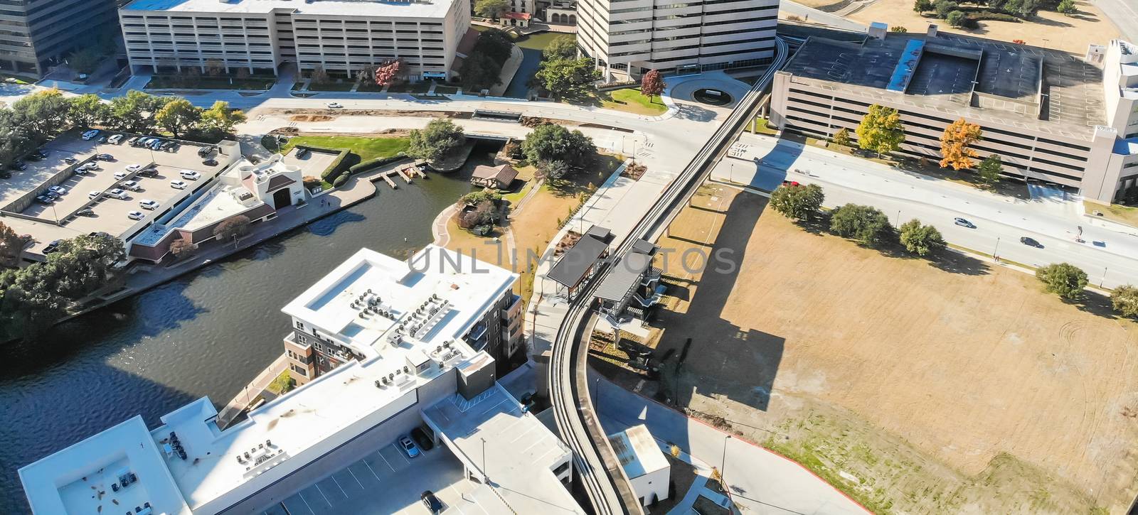 Panorama aerial view downtown Las Colinas, Irving, Texas and light rail system (Area Personal Transit, APT). Las Colinas is an upscale, developed area in the Dallas suburb