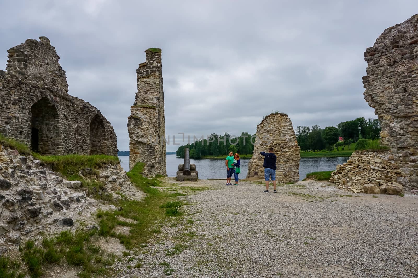 Koknese castle ruins. Latvian medieval castles. Archaeological monument of national importance. Tourists take pictures at old castle ruins Koknese, Latvia. The medieval castle of Koknese was a stone castle built in the medieval castle mound in Koknese, on the bank of the Daugava. Built shortly after 1209
