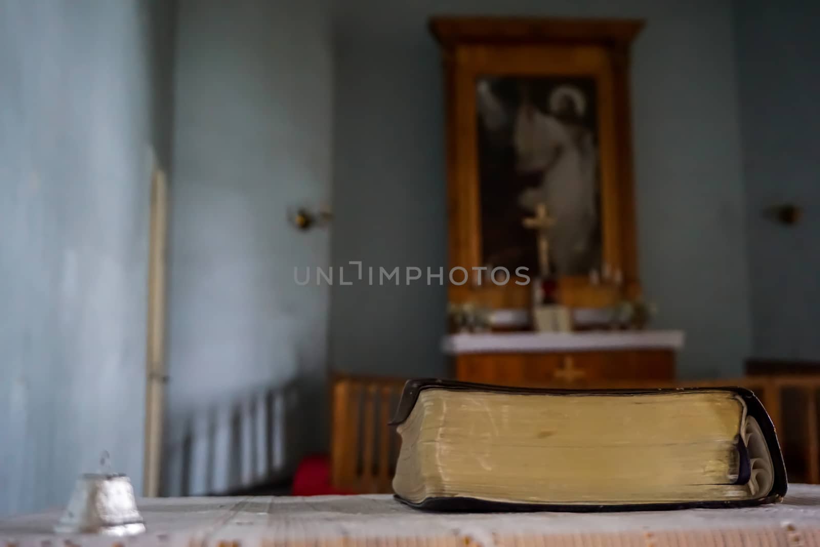 Evangelic Lutheran Church in Koknese, Latvia. Interior of Koknese church. Bible and bell at the Koknese Evangelical Lutheran Church. Church was built in 1687. 