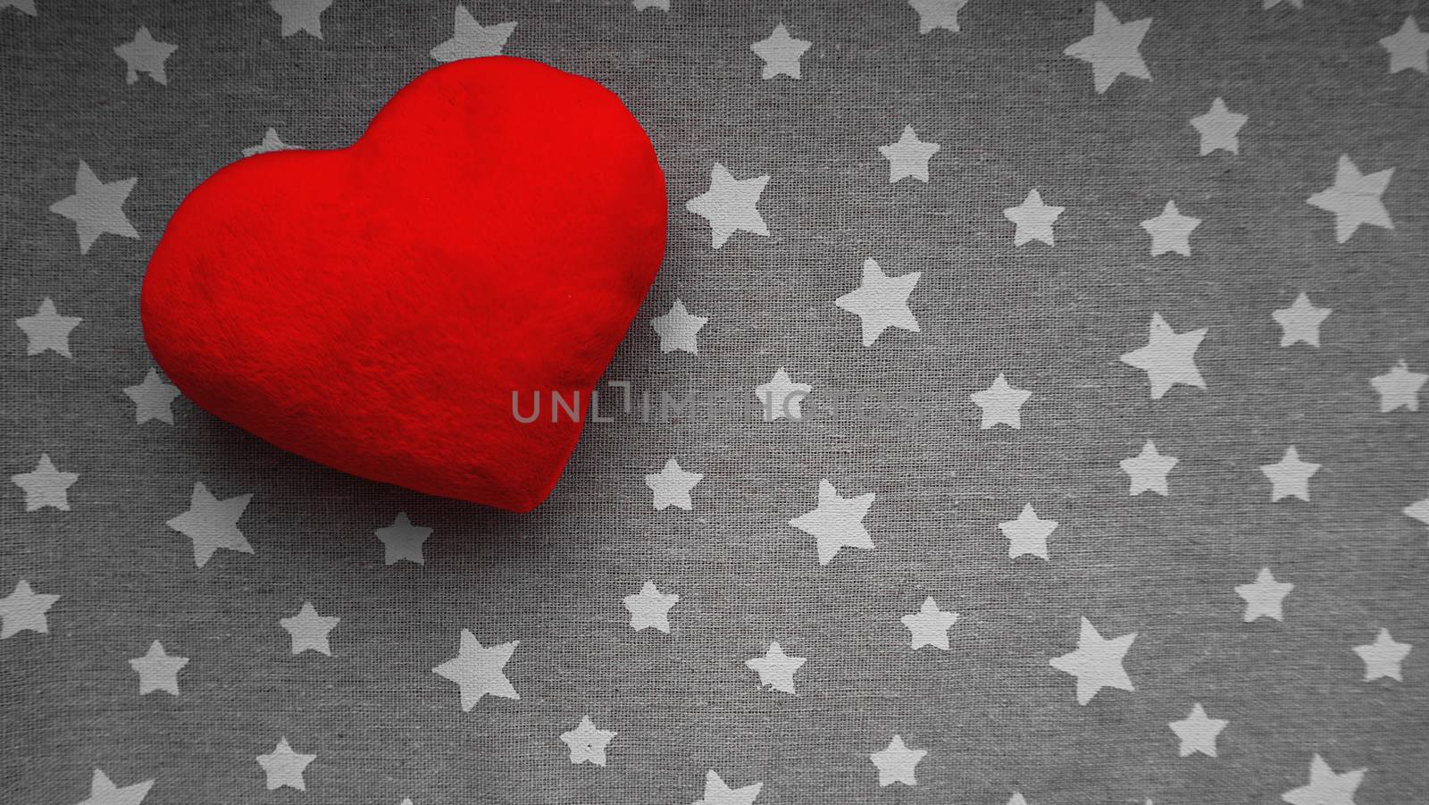 Valentines day background with soft toy heart on a gray background with white stars. Top view. for banner, cards design