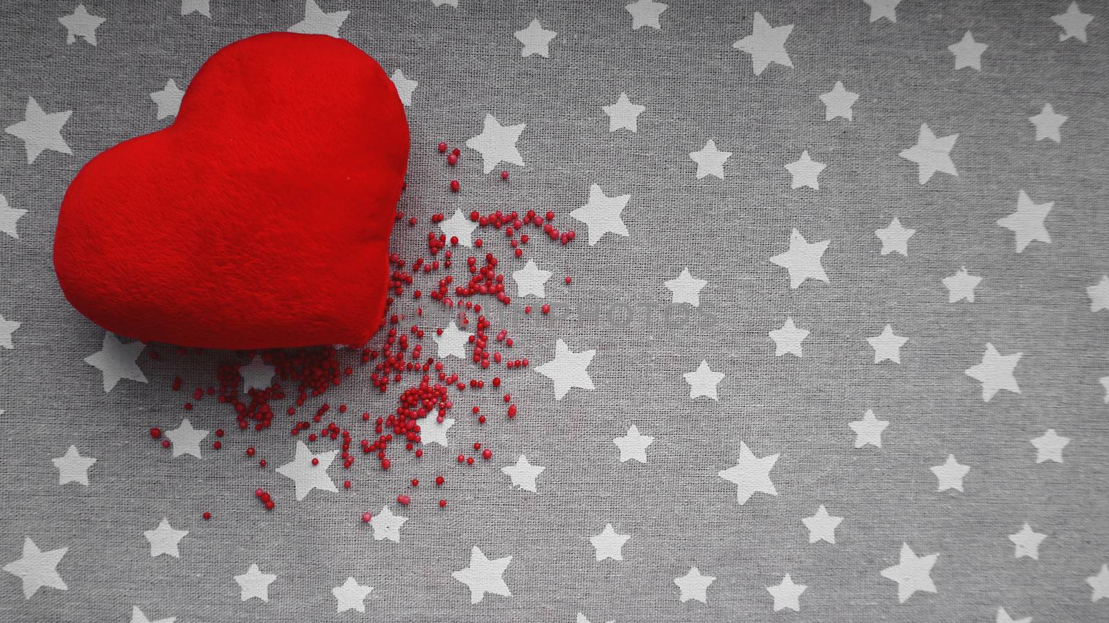 Valentines day background with soft toy heart on a gray background with stars by natali_brill