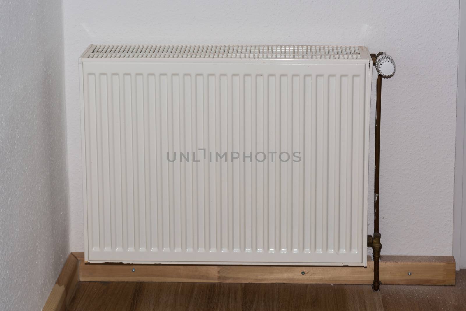 Old panel radiators in a renovated room.