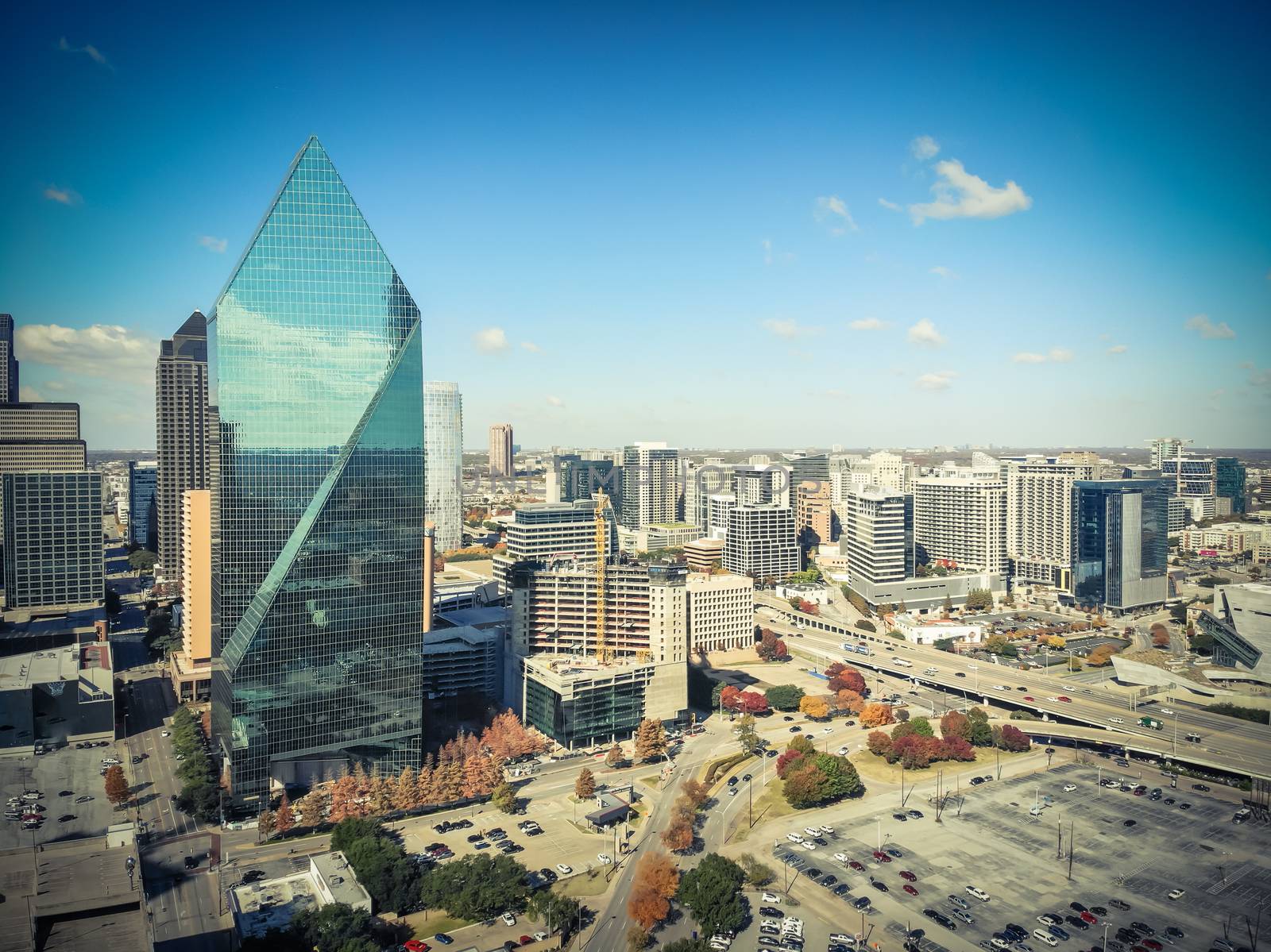 Aerial view of downtown Dallas, Texas during sunny autumn day with colorful fall foliages