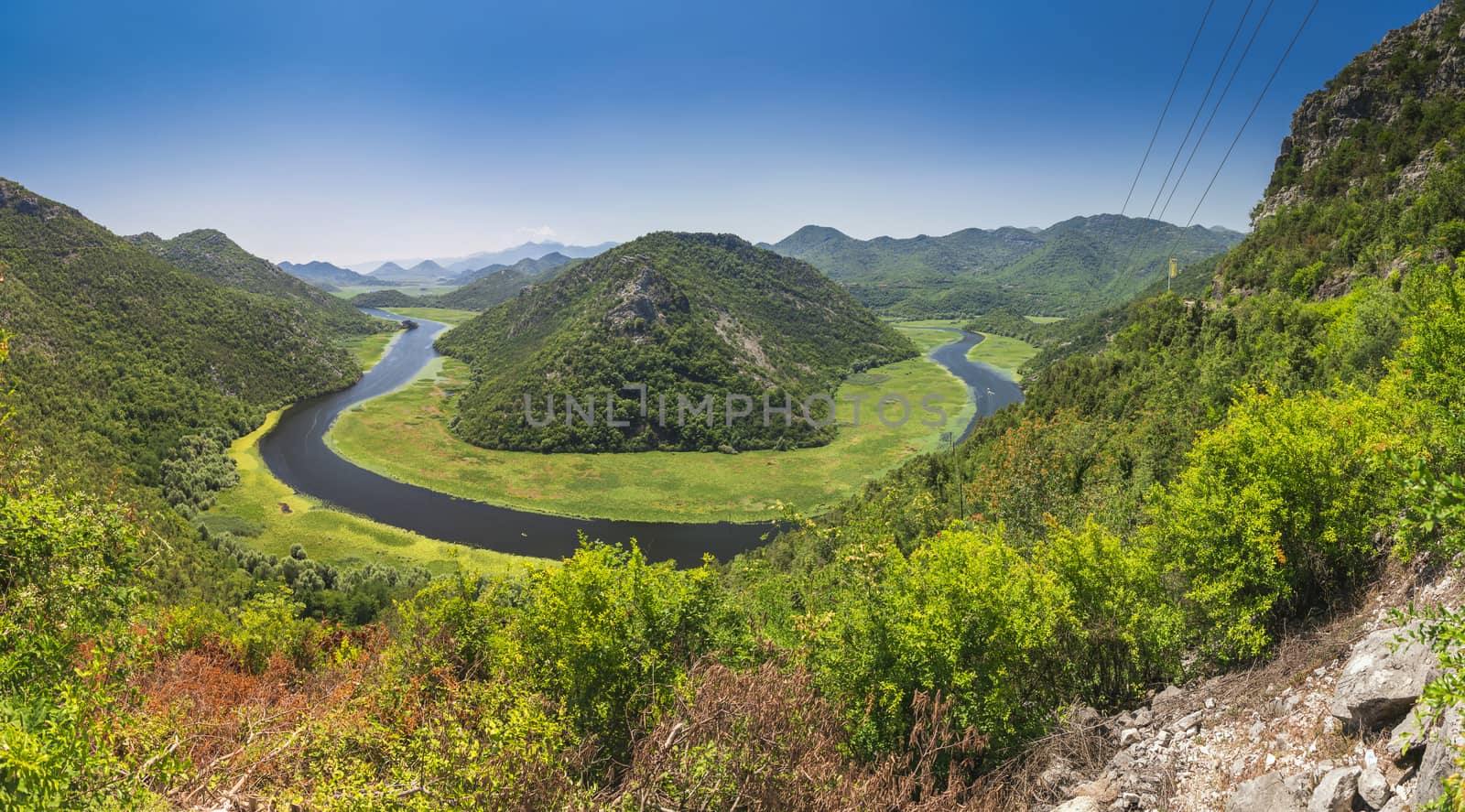 Panoramic view from above of the huge bend of Tsrnoyevicha river and the forest around, Rijeka Crnojevica in Montenegro