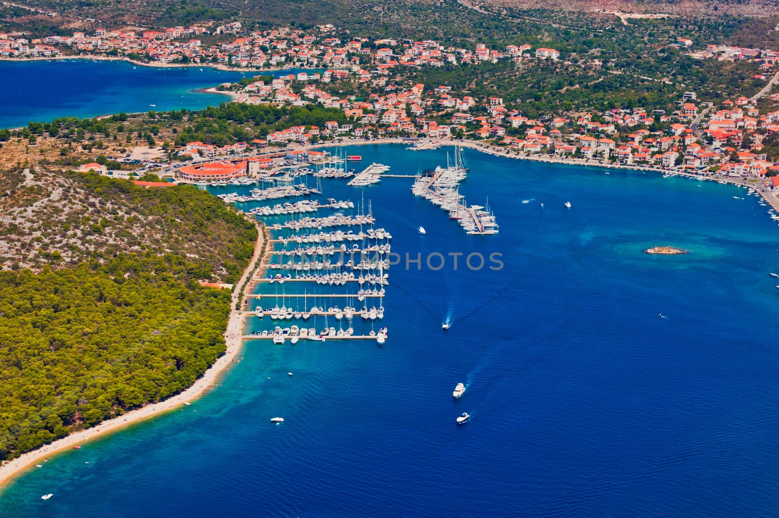 Aerial view of marina Rogoznica in Croatia, Adriatic sea, blue sea with beach and sailing boats, nautical tourism in Dalmatia