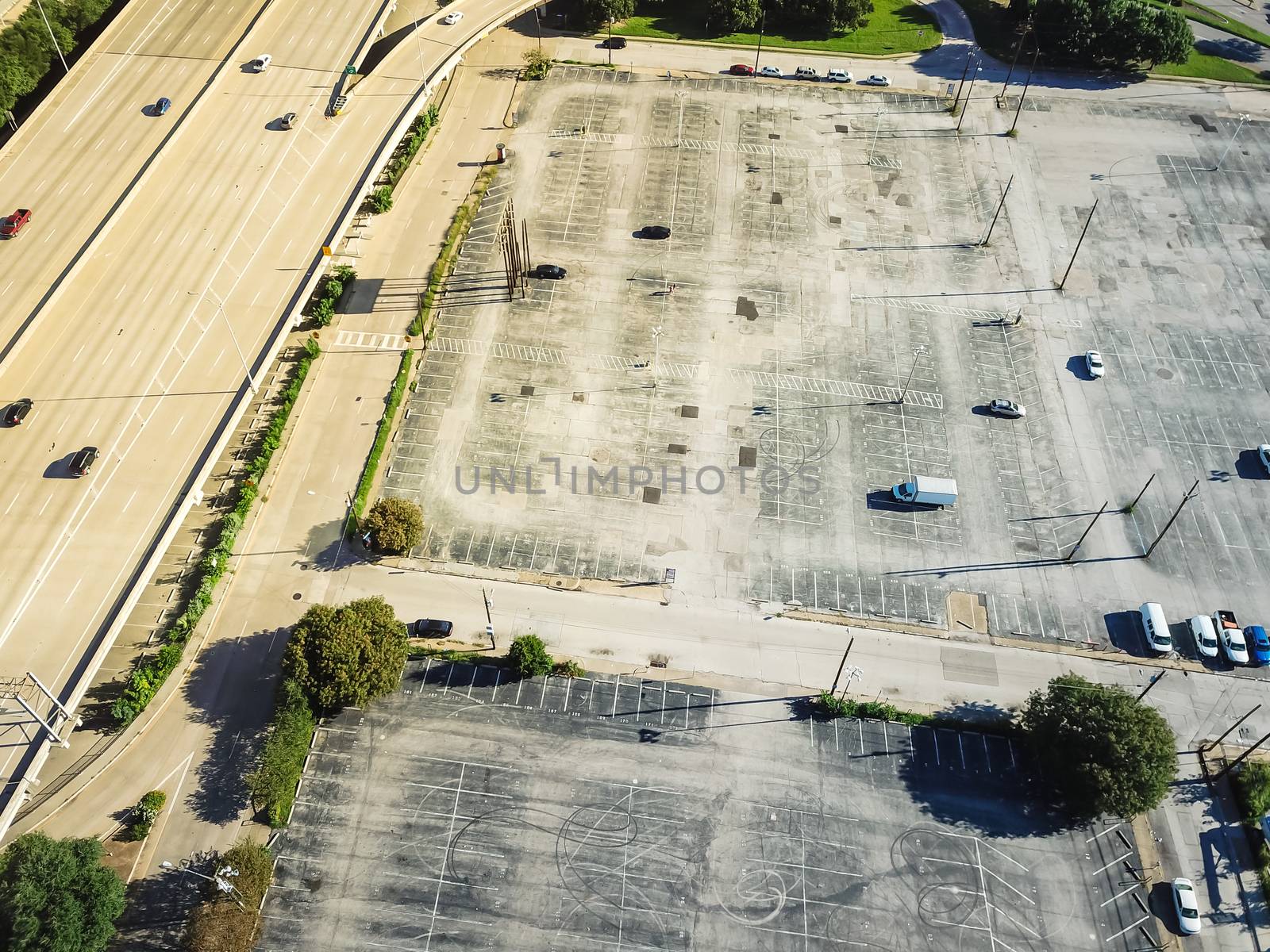 Aerial view parking lots with vacant spaces near expressway in d by trongnguyen