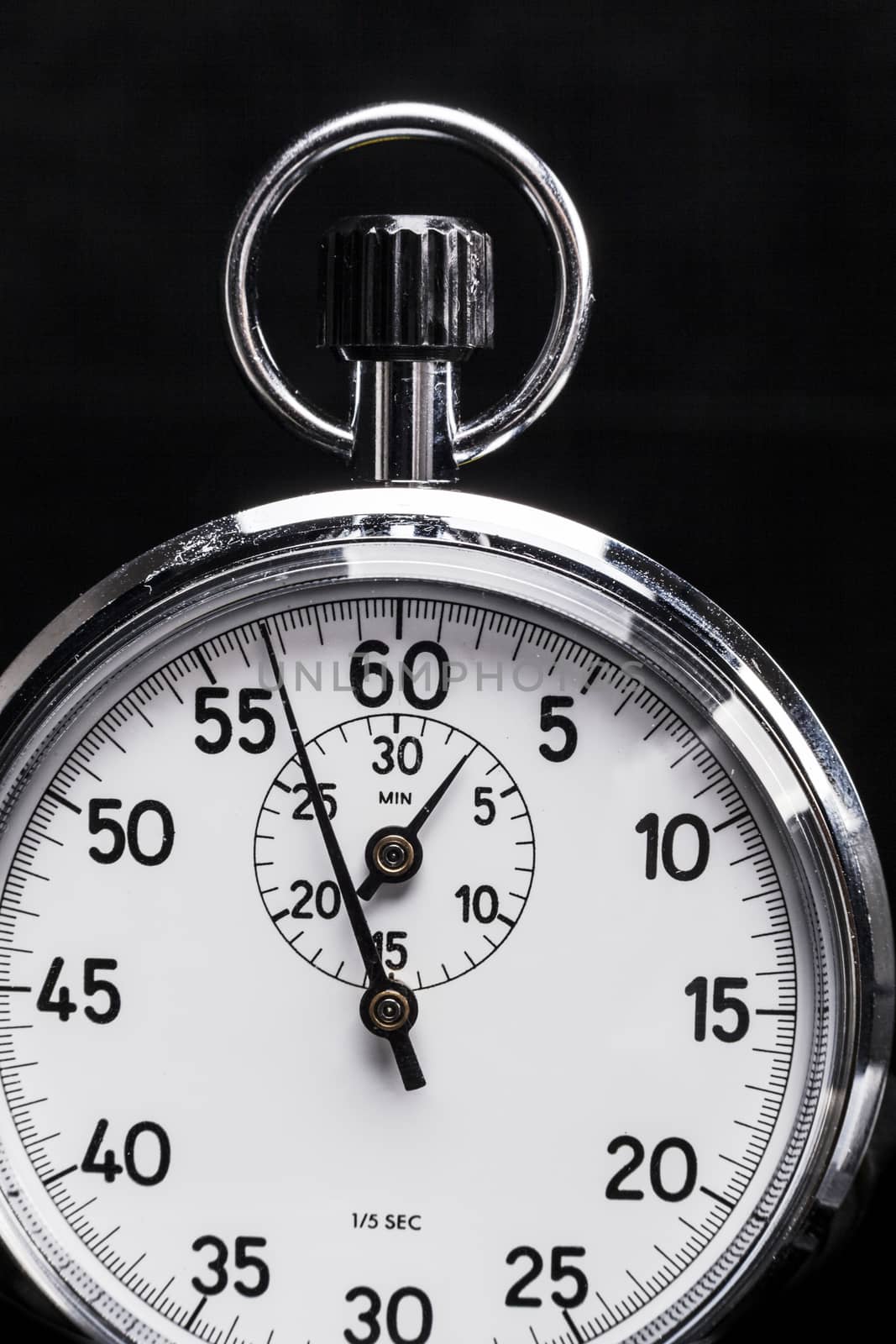 Silver vertical chronometer isolated on black background