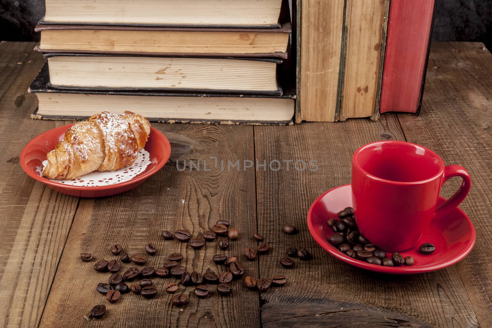 Morning Croissant and coffee with some books