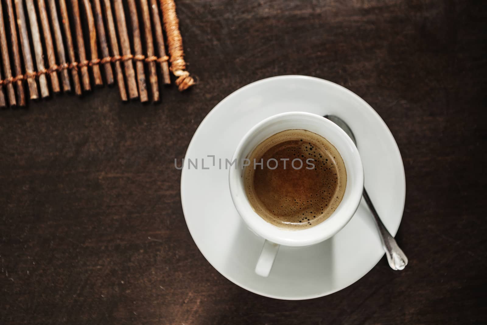 A white cup filled with delicious coffee