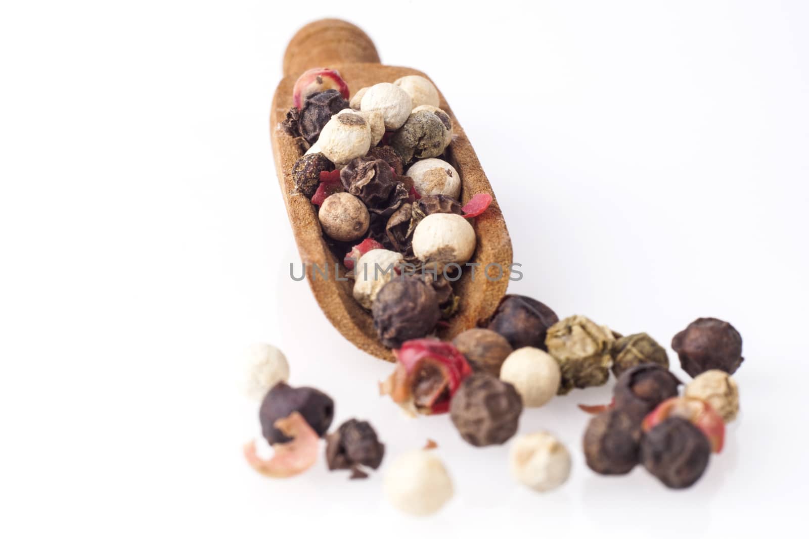 Black Pepper on Wood Spoon Isolated on White Background