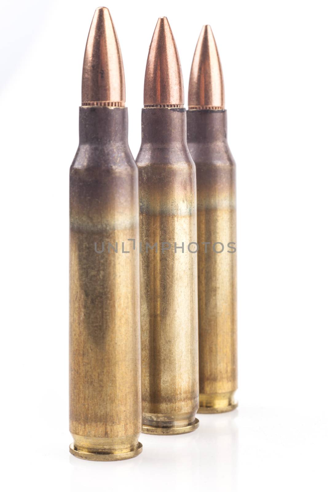 Three Isolated Bullets On White Background With Reflection