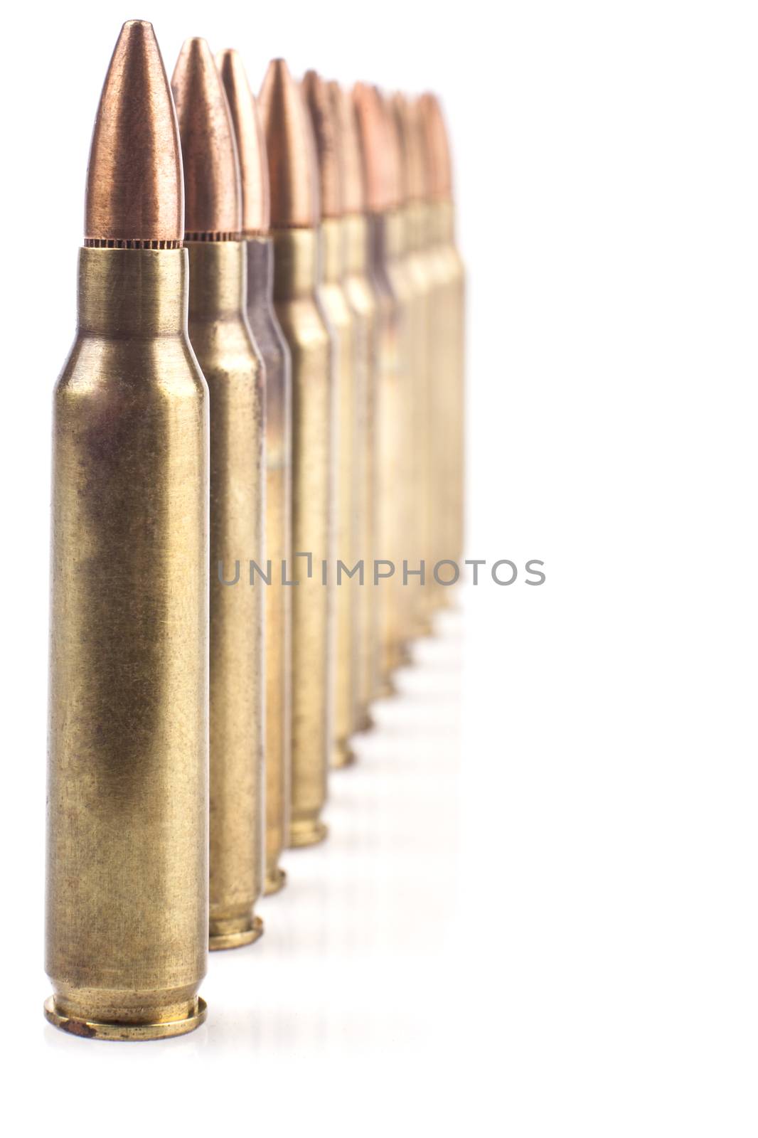Row of  Isolated Bullets On White Background With Reflection