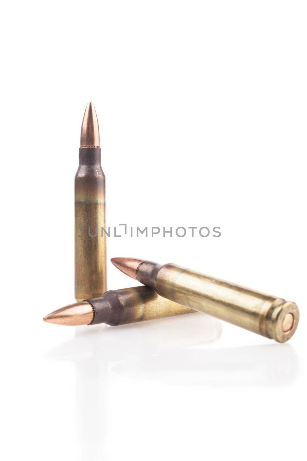 Three Isolated Bullets On White Background With Reflection