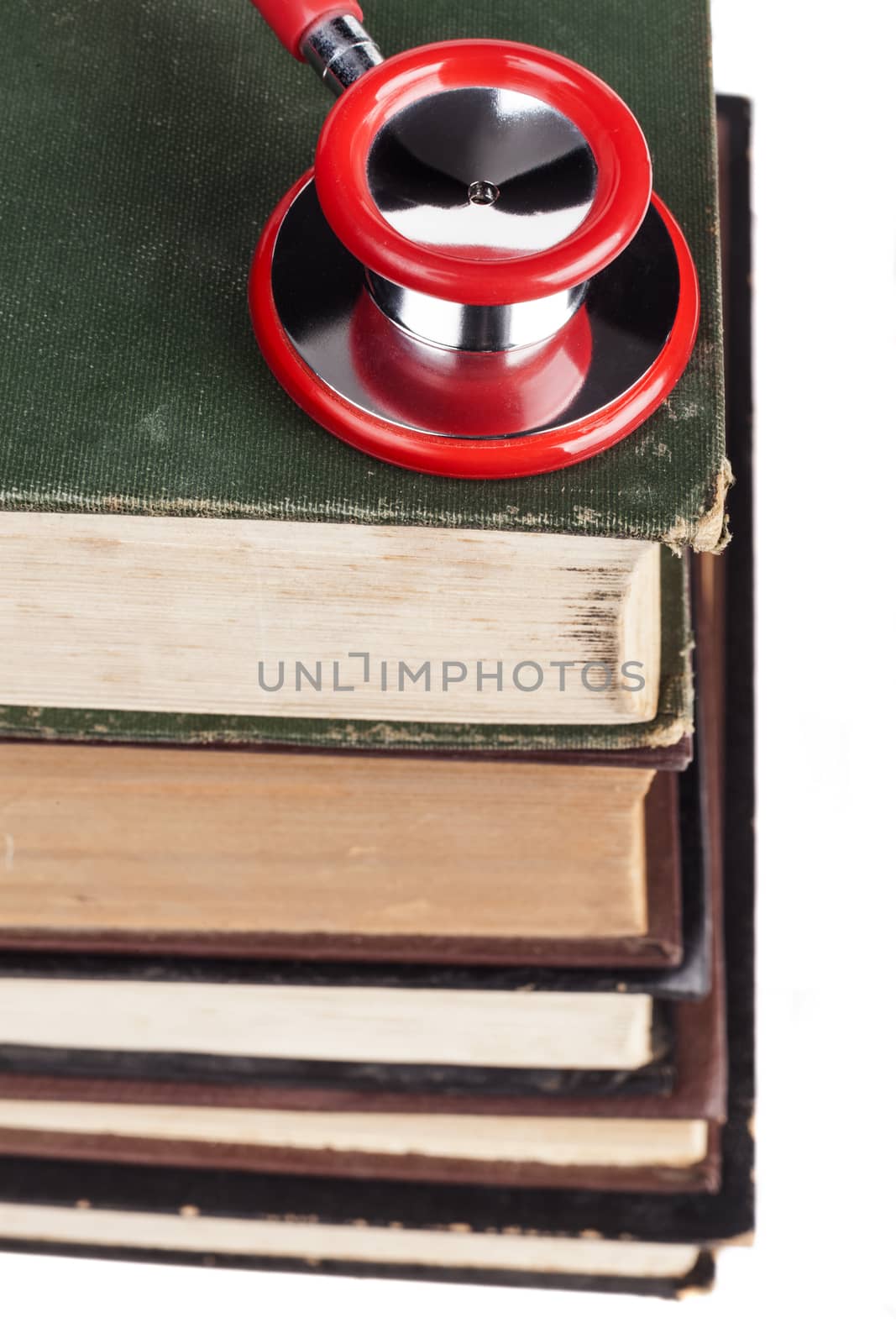 Old Books Red Stethoscope Isolated on White Background