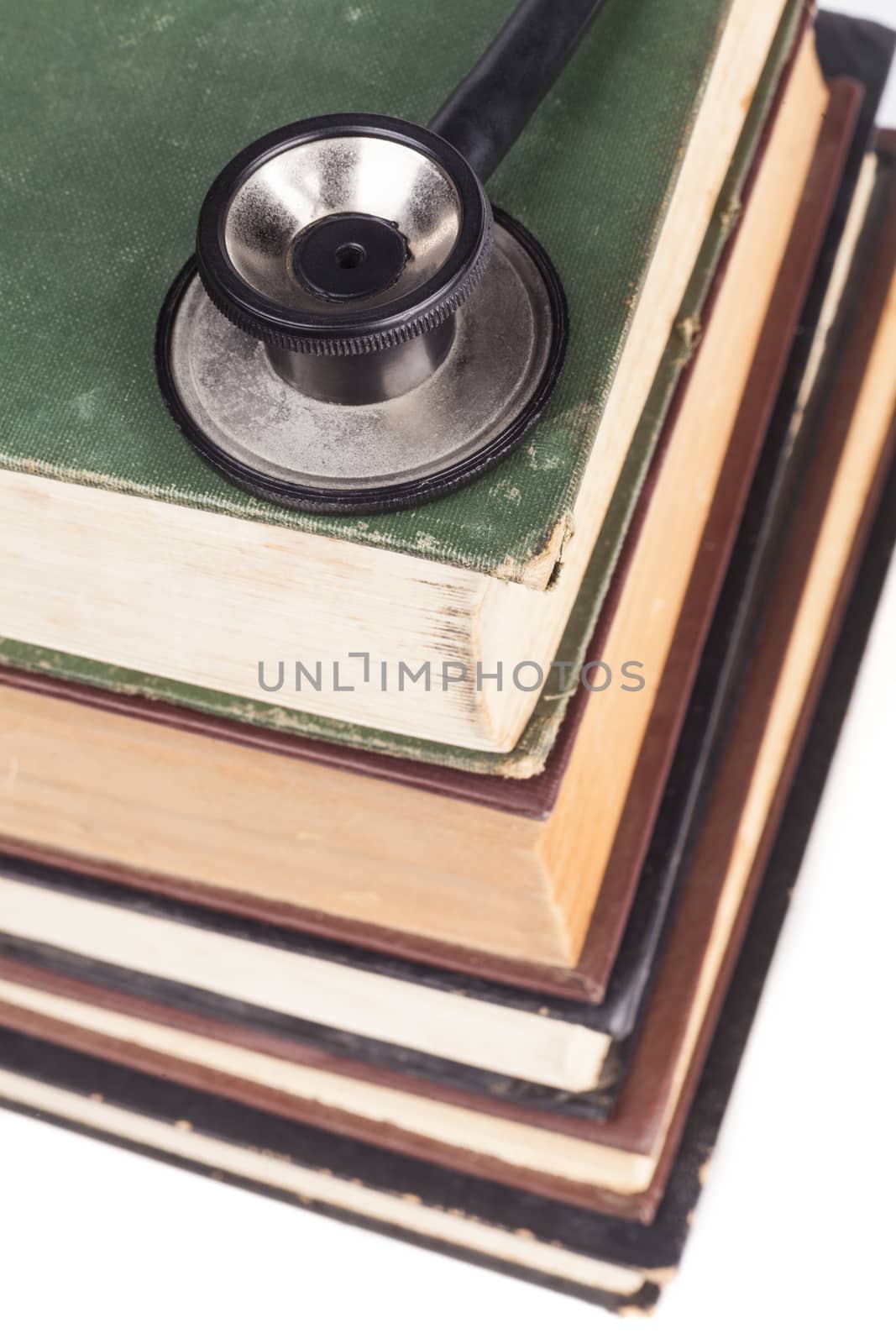 Old Books Black Stethoscope Isolated on White Background