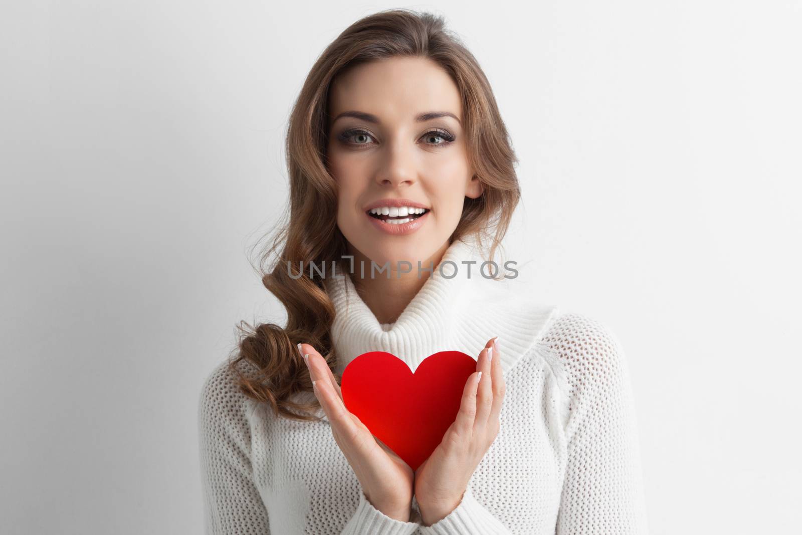 Woman holding paper heart shaped card . Valentine day concept . I'm looking waiting for partner ! Advertising people person relationship couple concept , white background