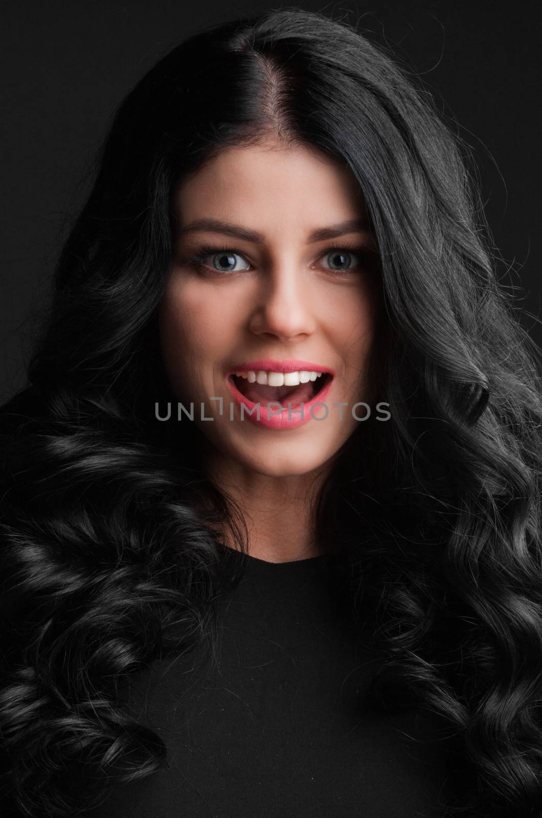 Portrait of a beautiful surprised young woman . open mouth . holiday gift Valentine day concept