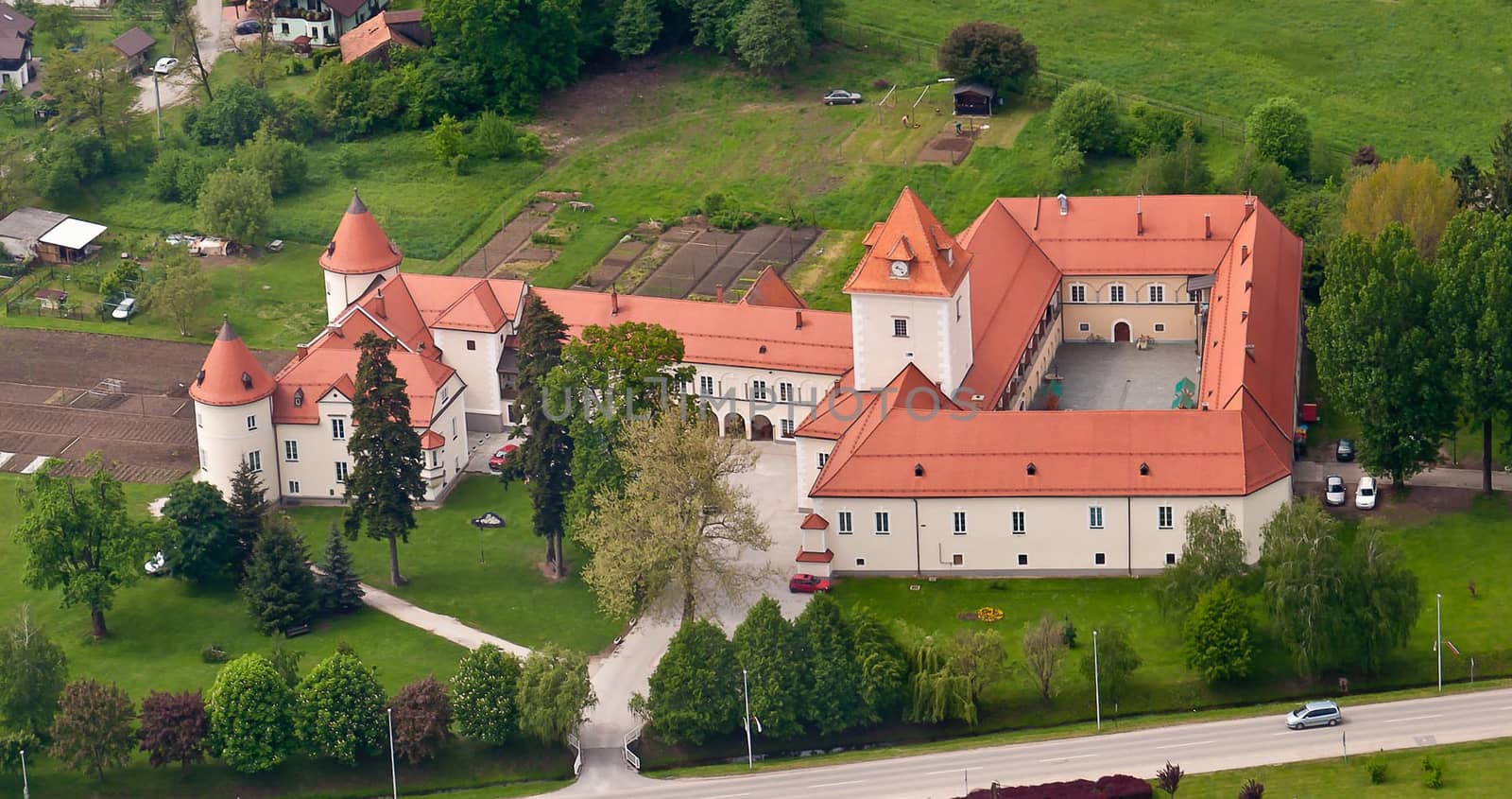 Medieval castle in European village, municipality Race Fram in Slovenia, aerial view, lower Styria near Maribor