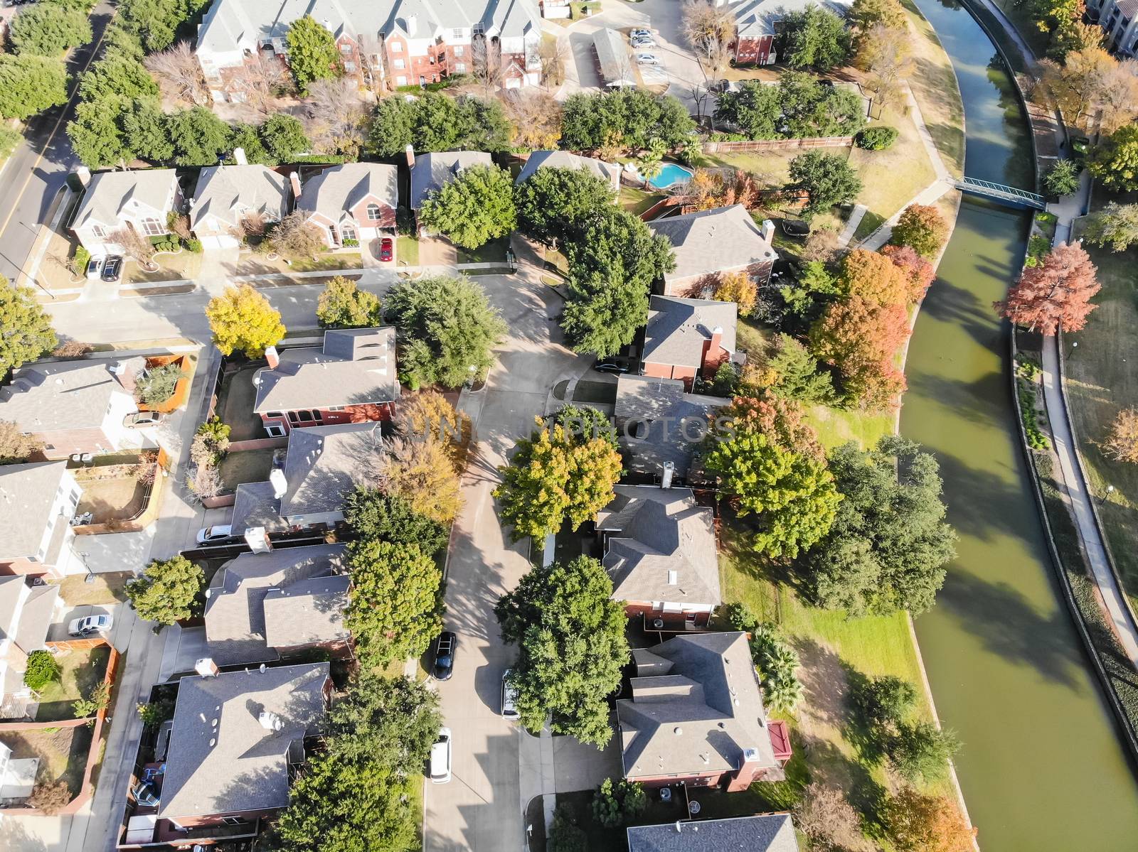 Straight down aerial view residential neighborhood in fall season with colorful leaves near Dallas, Texas
