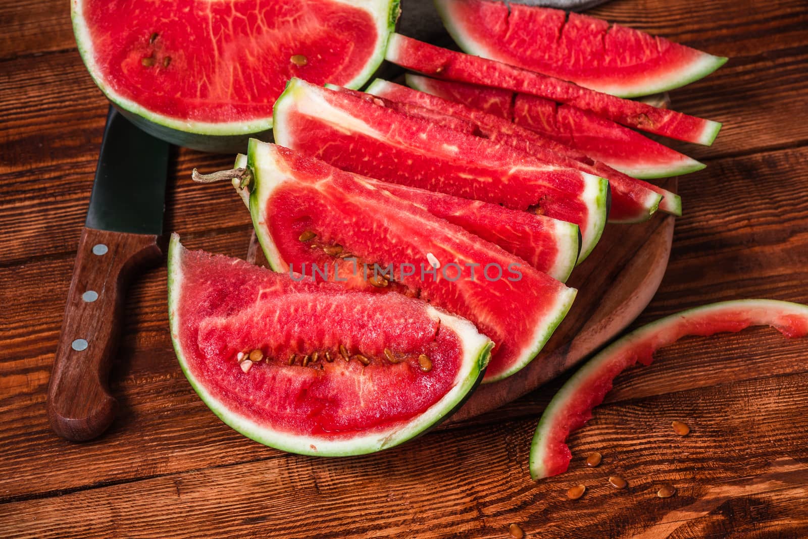 Watermelon slices lying on the cutting board by Seva_blsv