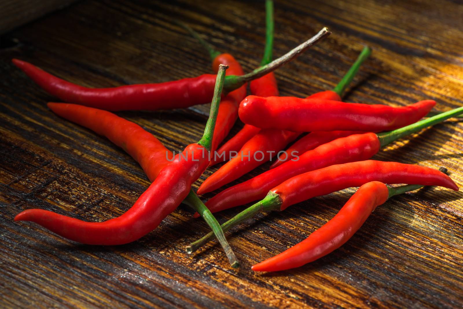 Pile of mini chili peppers. Burning spicy ingredient