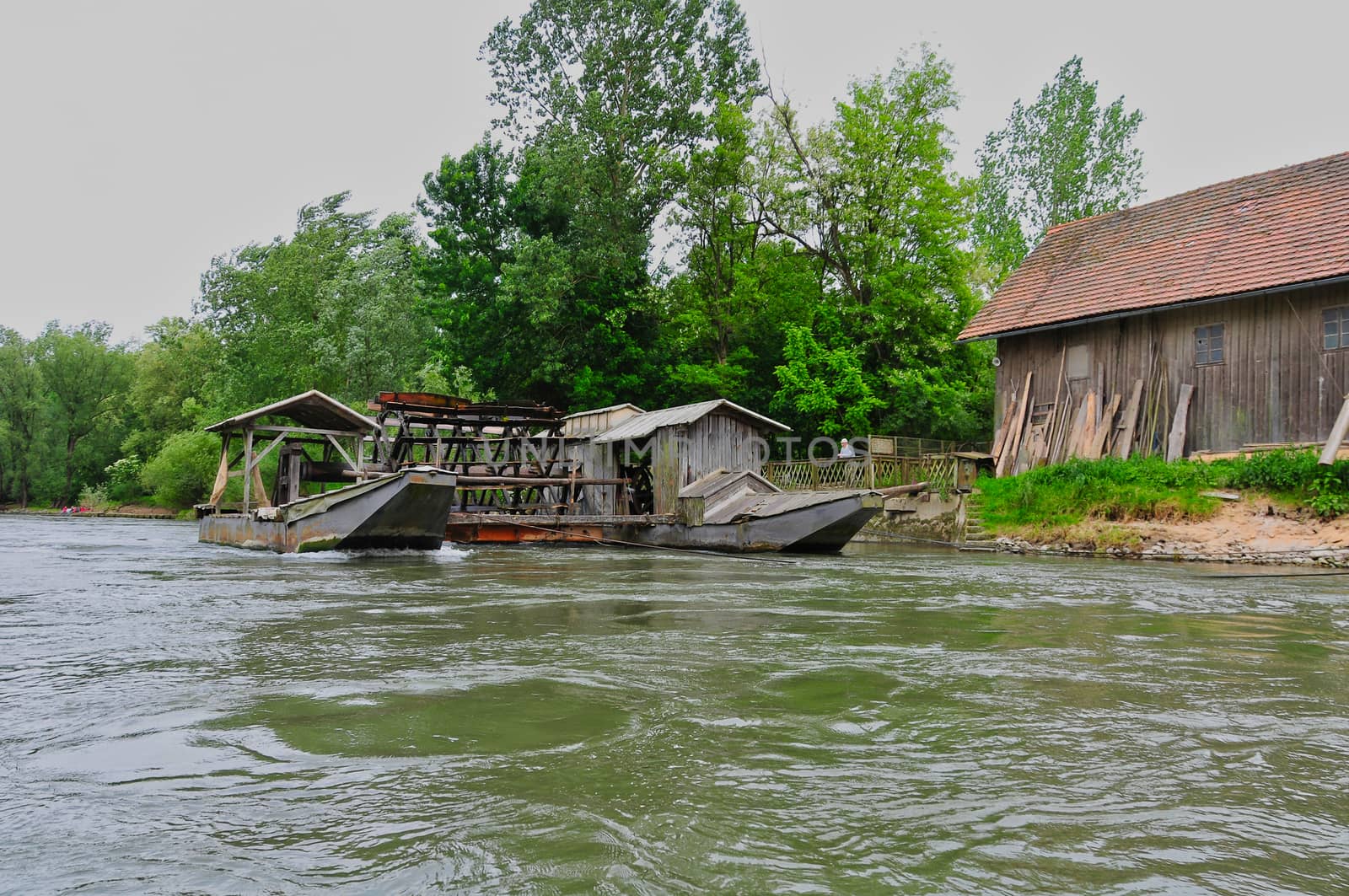 Unique traditional boat mill on a river by asafaric