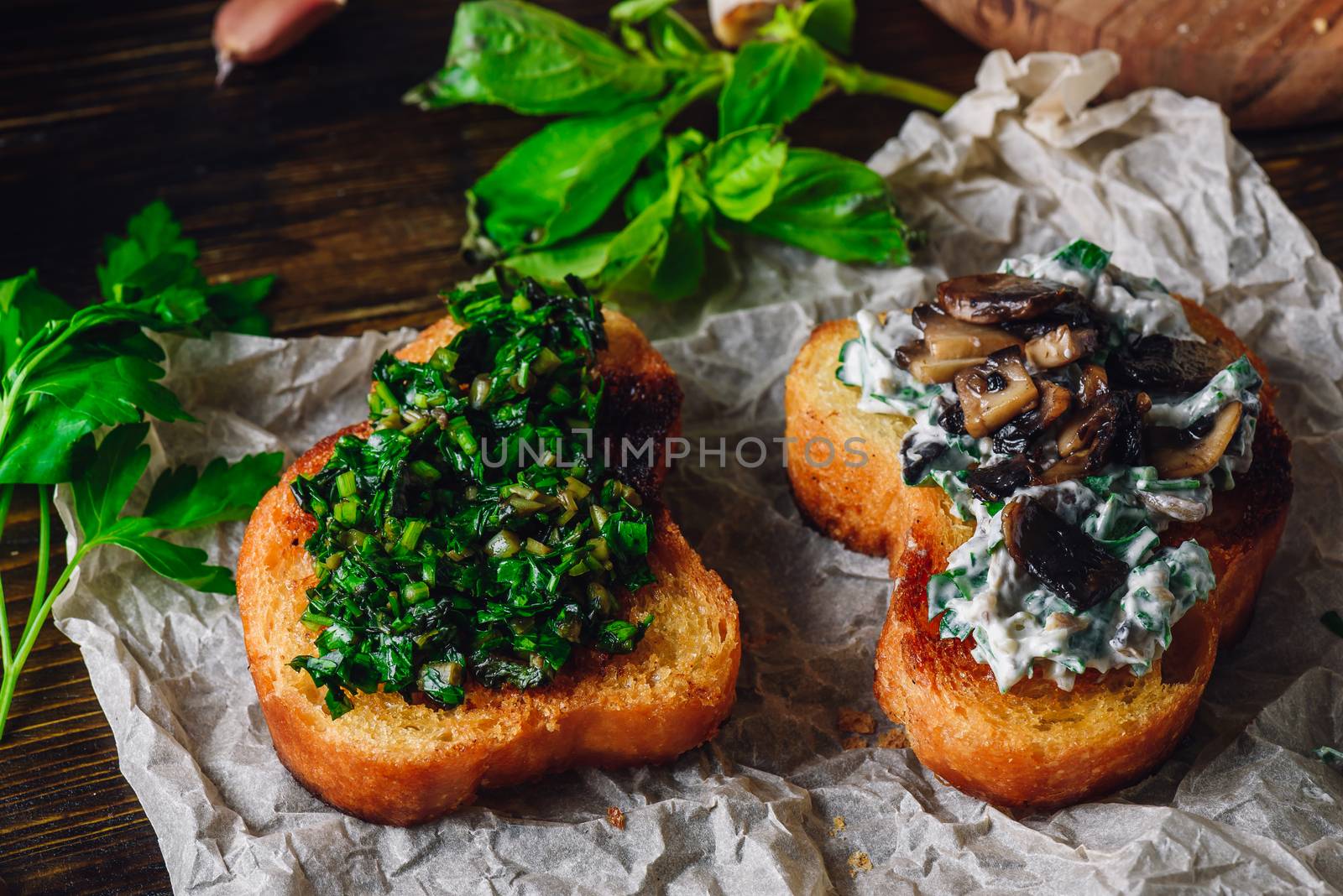 Italian Snack. Two Bruschettas with Greens and Mushrooms on Paper.