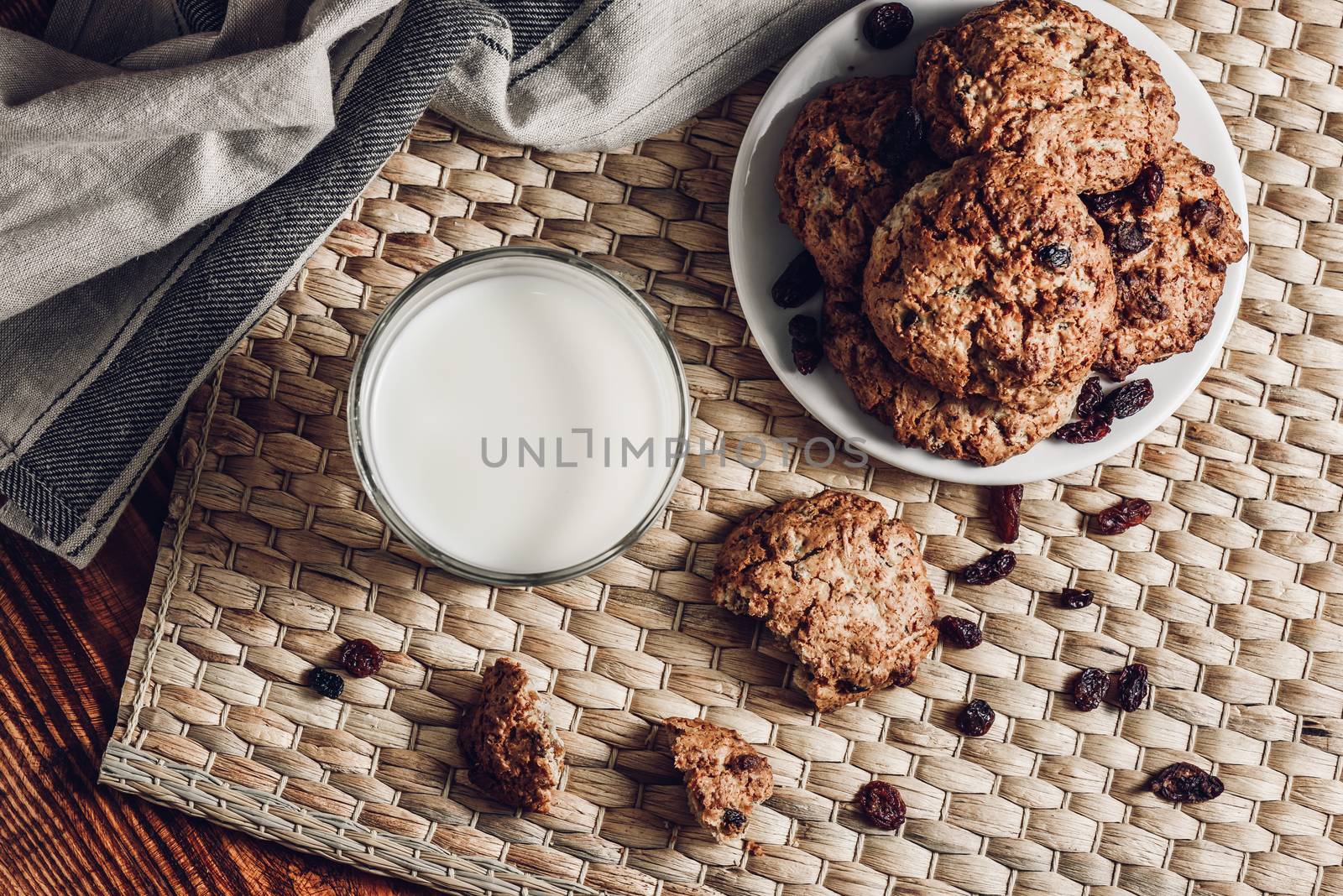 Glass of Milk and Oatmeal Cookies on White Plate by Seva_blsv