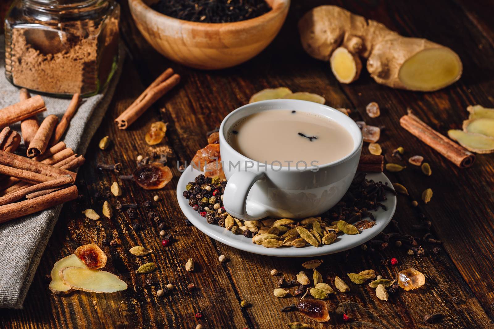 Indian Masala Tea in Cup with Ingrediants. Spicy Beverage.