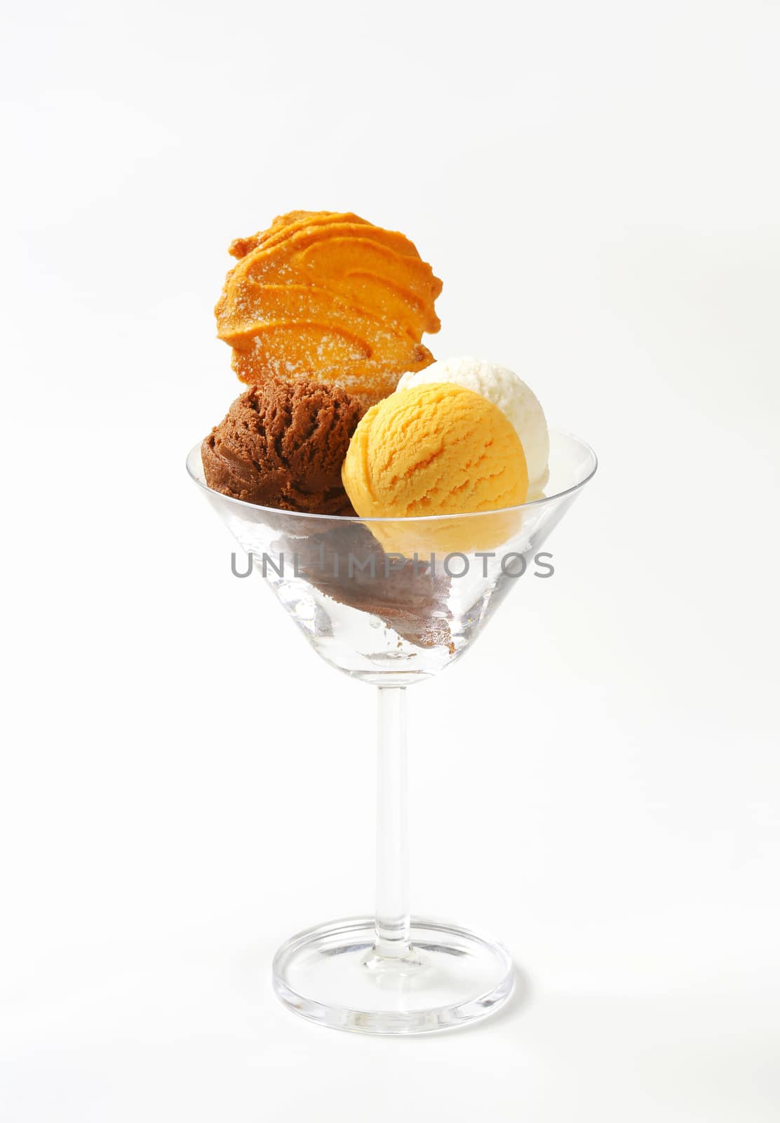 Three scoops of ice cream in glass decorated with Spritz cookie