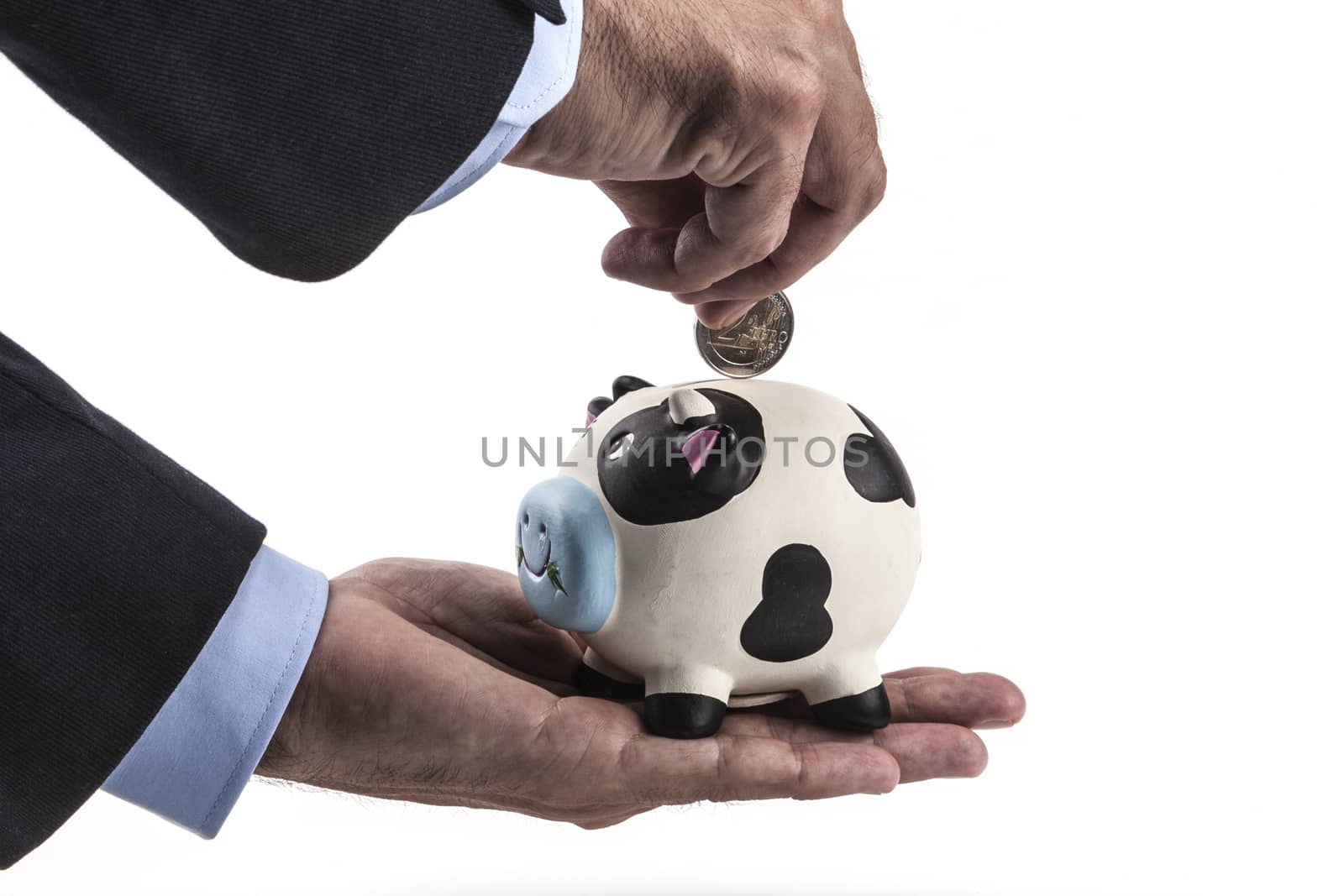 Hand holding a piggy bank isolated on white background